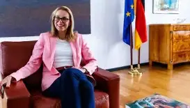 ambassador Maria gosse is sitting in a brown leather chair in her office in Mexico city.